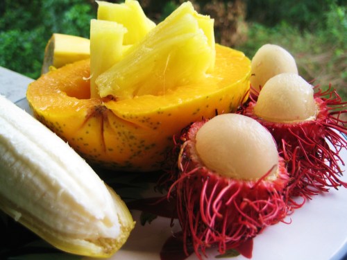 What to eat after a tropical sunrise, all local, a fresh, apple banana, papaya, pineapple, and rambutan.